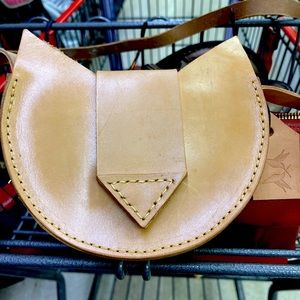 Cute leather purse.  Comes with storage bag